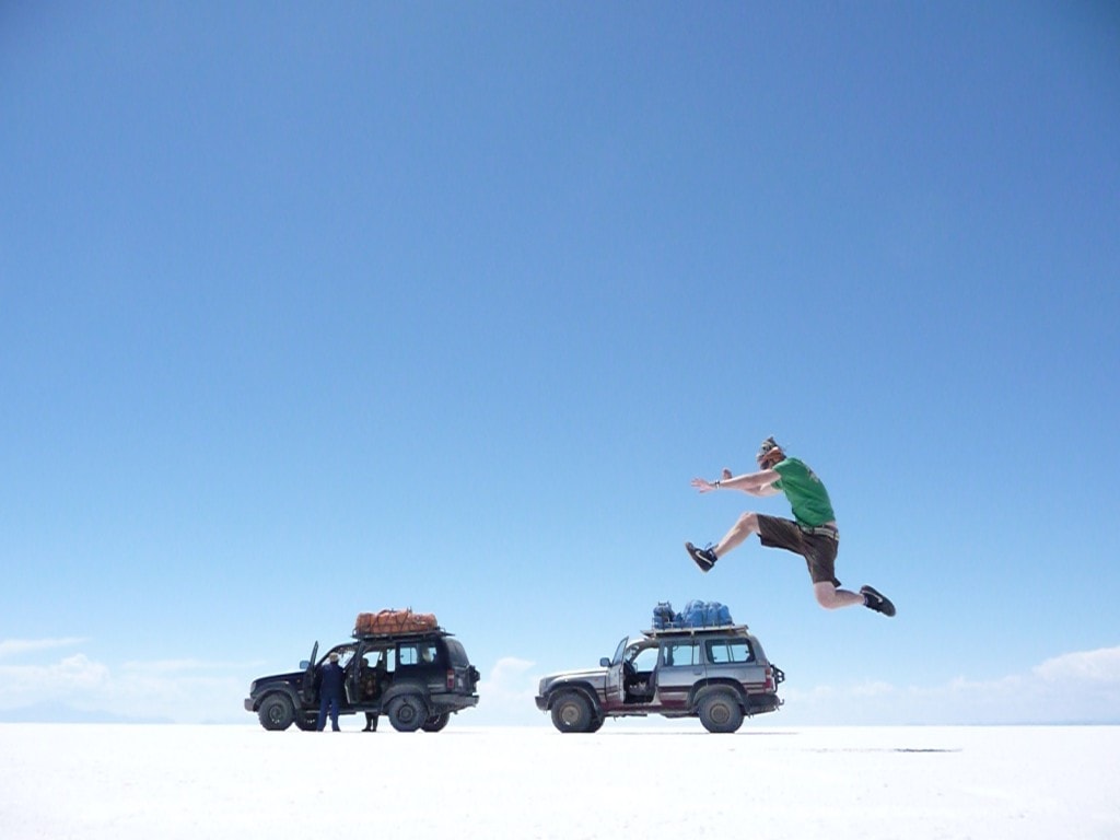 Jumping two land cruisers on the salt flats of Bolivia