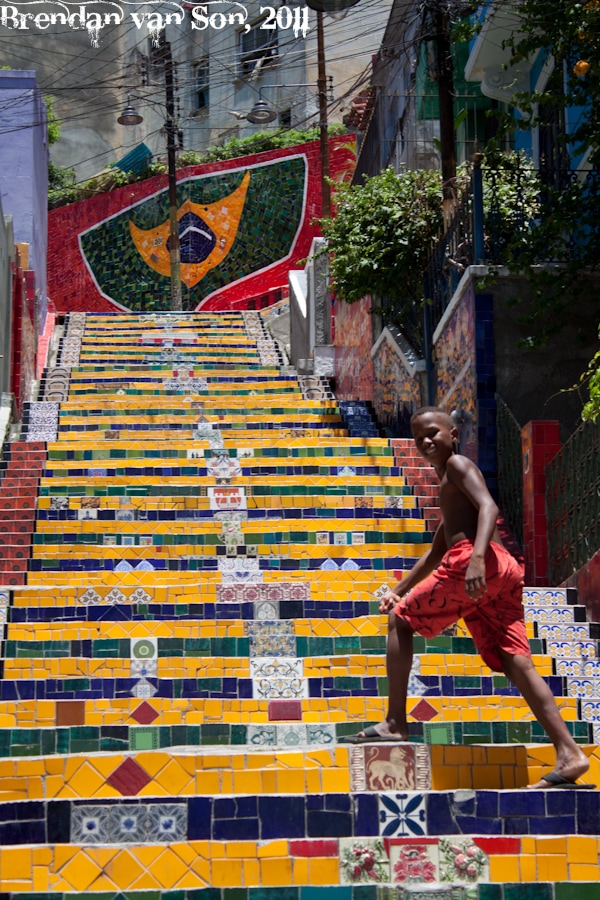 Boy climbing the famous Escalera de Selaron in Rio de Janerio
