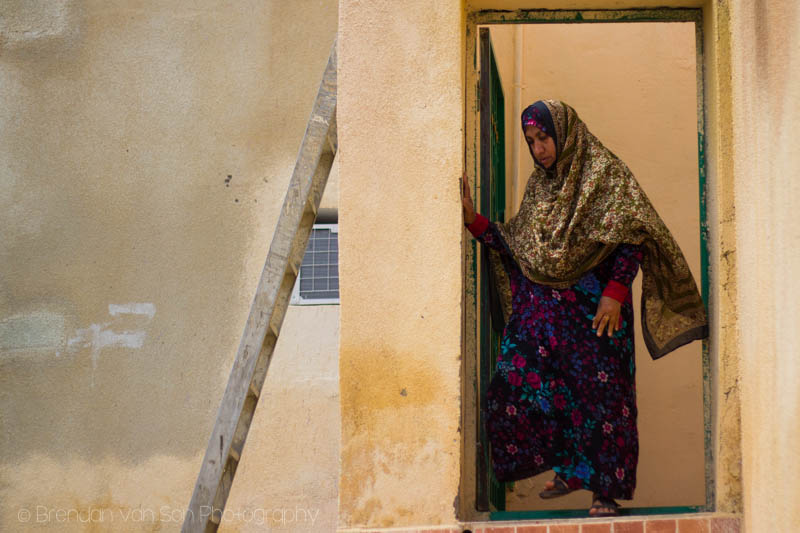 A woman in Oman leaving her home.