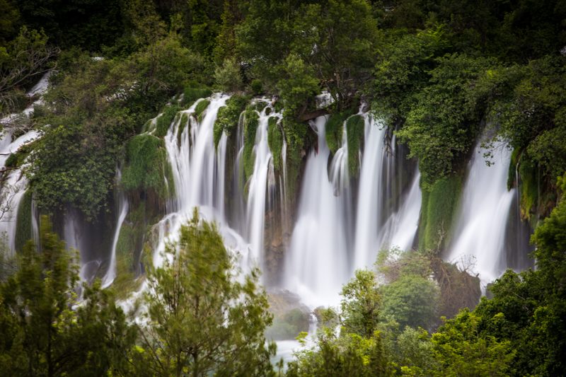 Kravice Falls, Herzegovina. A silky smooth waterfall in the lush green forest.