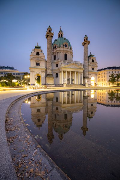 Vienna's karl's church at dawn with a reflecting pool